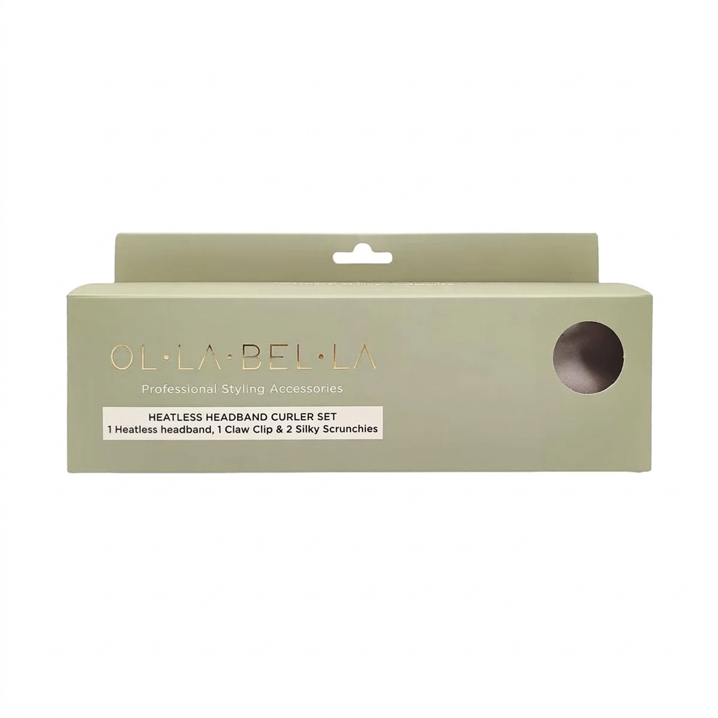 The Olla Bella Heatless Curling Headband Set in its original packaging, featuring a sage green box with gold lettering and a circular cutout window showing the headband and accessories inside.
