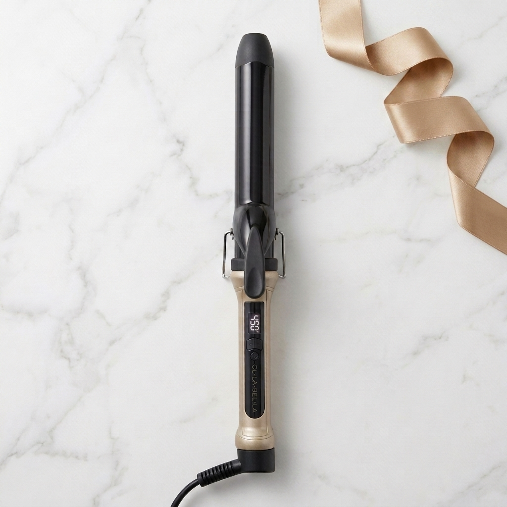 The Olla Bella 1.25" Ceramic Digital Curling Iron shown on a white marble background with a gold ribbon.