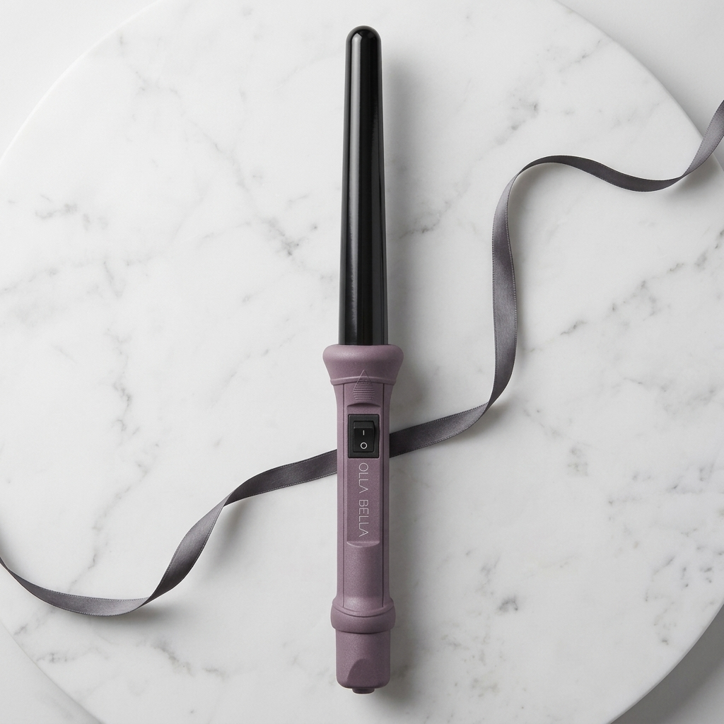 The Olla Bella 1" Ceramic Curling Iron in Plum Metallic with a gray ribbon displayed on a white marble background.